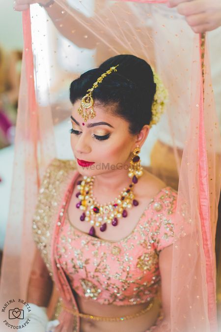 Photo of Bride getting ready with dupatta on head
