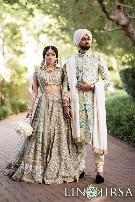 Coordinated bride and groom in pretty outfits
