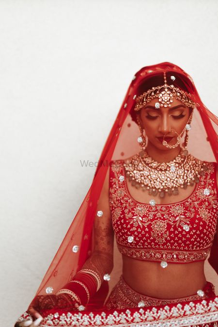 Photo of Bride under the veil shot