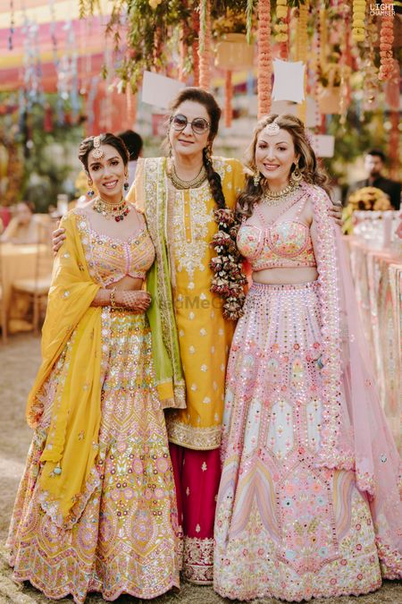 Photo of bride squad in pretty colorful lehengas