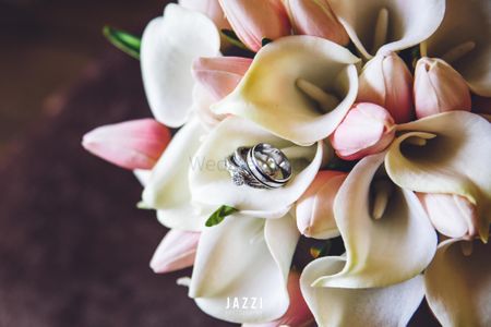Photo of Engagement rings inside bridal bouquet
