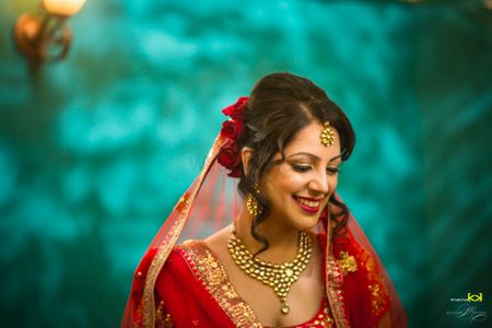 Photo of Bridal makeup and hairstyle for red bride