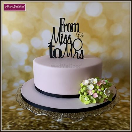 Photo of Bachelorette party cake with topper