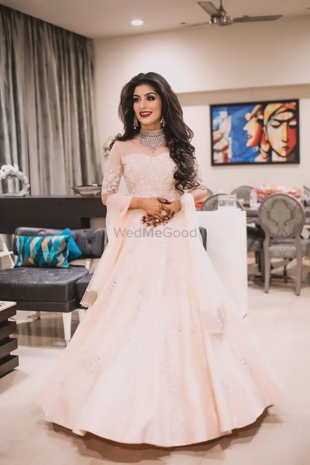 Photo of Bride with long hair in white cocktail gown