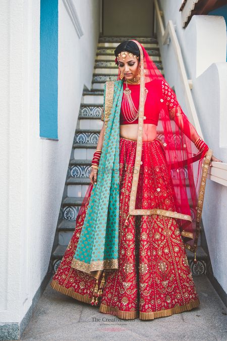 Photo of Red gota patti lehenga with turquoise dupatta