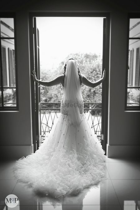 Photo of Black and white portrait with ruffled gown with train
