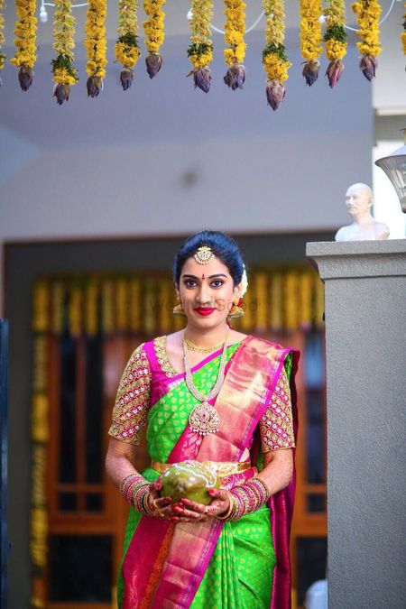 South Indian bridal look with green and pink kanjivaram
