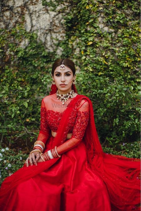 Bride wearing red lehenga on the wedding day.