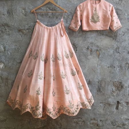 Scalloped edge lehenga in pastel pink with silver motifs
