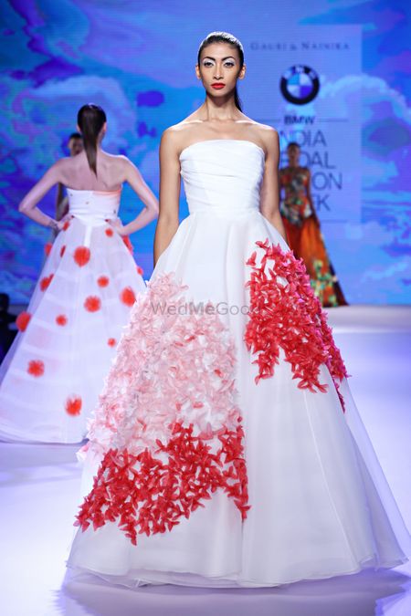 Photo of White and red strapless evening gown