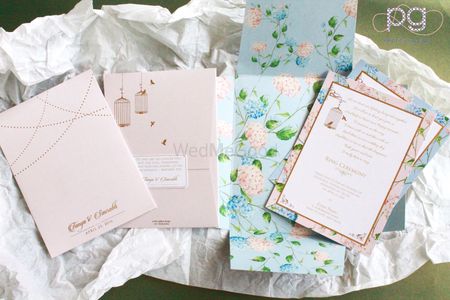 pastel blue and pink floral print wedding invite