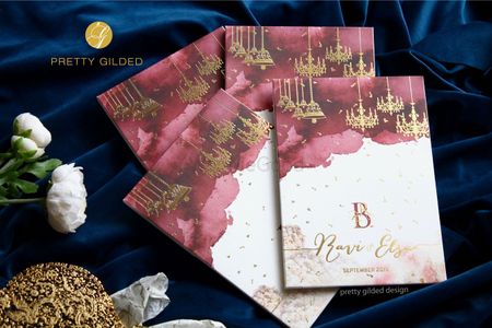 Photo of maroon and gold modern wedding invites