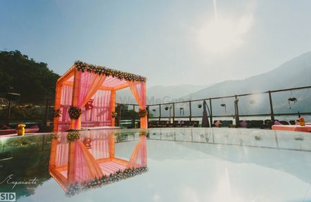 pink and orange theme pool-side mandap decor