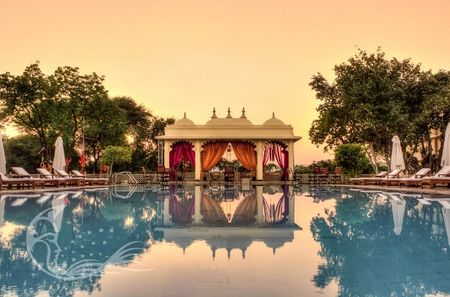 Poolside mandap decor in pink and yellow