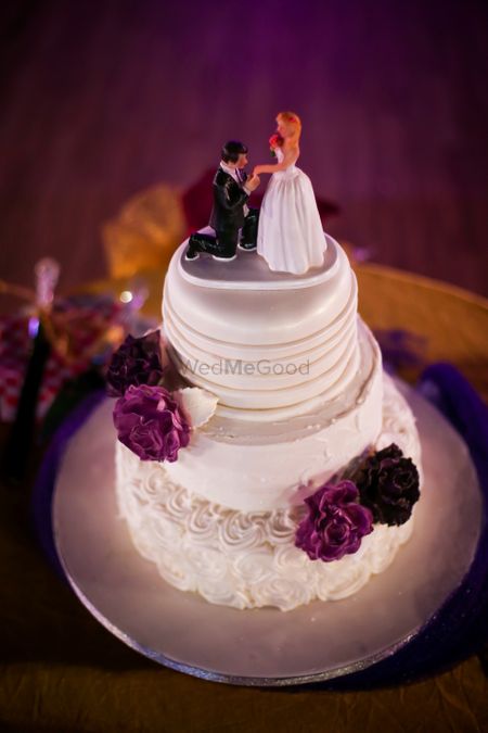 Wedding cake with proposal shot topper