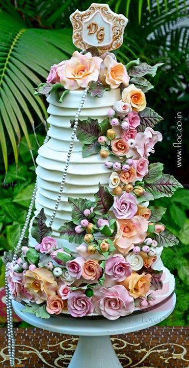 Photo of mint wedding cake with ruffles and layers