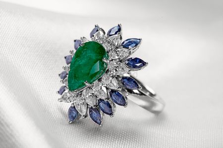 Photo of emerald and sapphire cocktail ring with diamonds