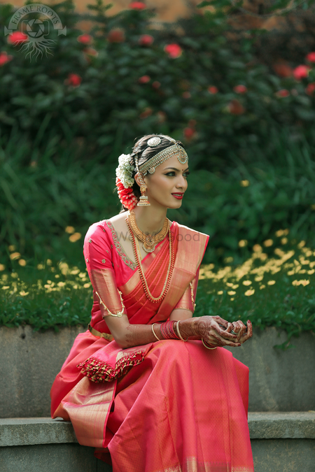 Photo of South Indian bride in red and gold kanjivaram and silver mathapatti
