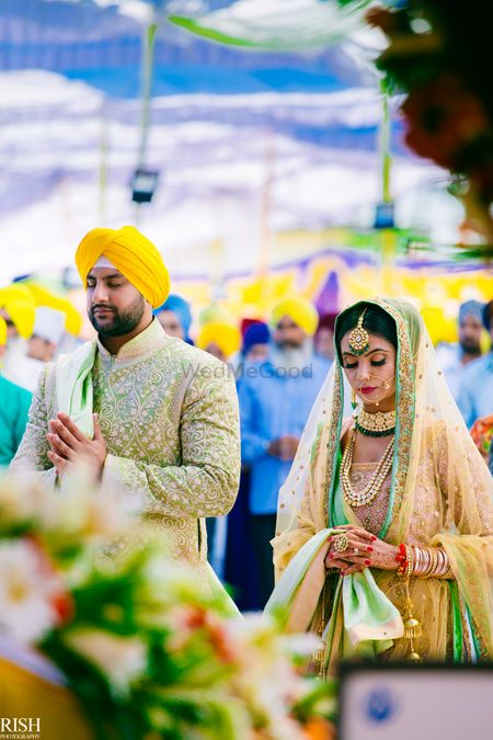 Sikh wedding with bride and groom in unique colours