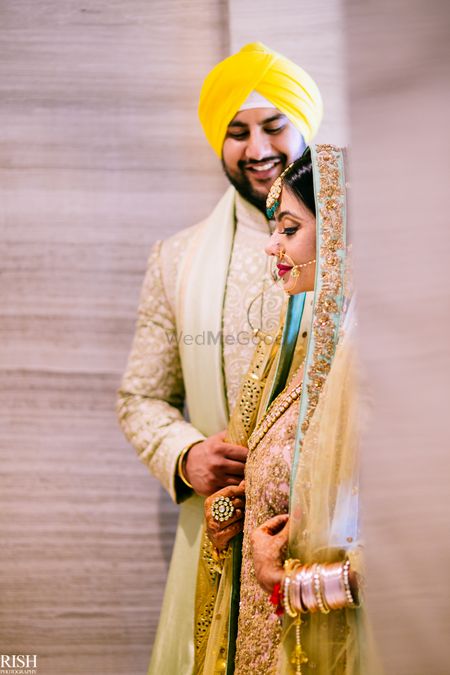 Cute bride and groom portrait in contrasting outfits