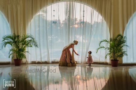 Cute bridal portrait with baby girl 