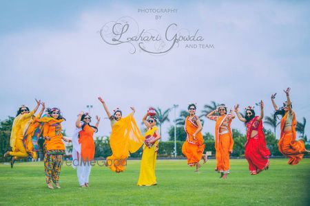 Matching bridesmaids jumping in the air