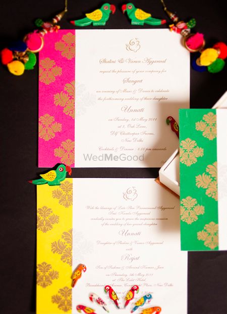 Colourful wedding invitation card with pompoms
