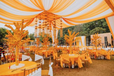 Photo of Yellow and white decor at a wedding function