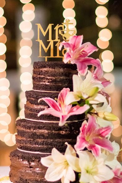 Chocolate wedding cake with florals and mr and mrs topper