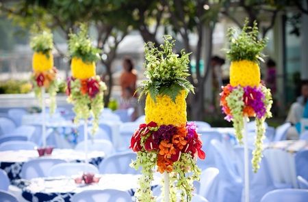 Summer wedding idea with pineapple shaped floral centerpiece