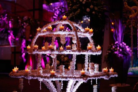 Photo of candle lit and floral entrance decor