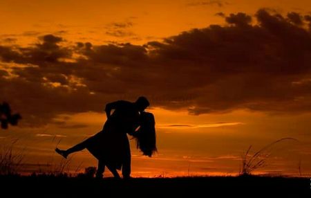 Photo of couple kissing pre-wedding shot