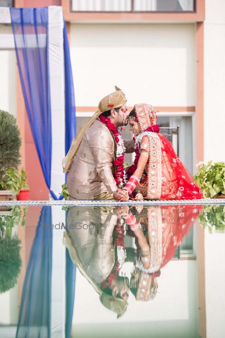 Couple Kissing Portrait with Reflection in Water