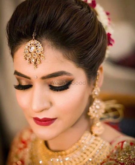 Brown smokey eyes and red lips for the bride