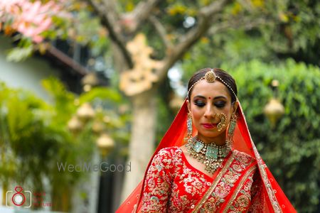 Unique blue choker necklace with red bridal lehenga