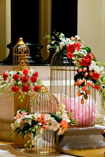Birdcages with floral arrangements