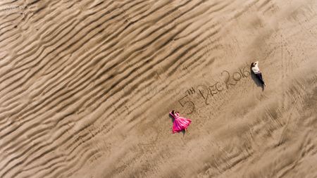 Save the date idea on sand with drone photography