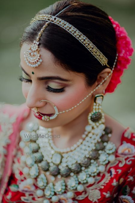 Photo of bridal hairband with stones and maangtikka