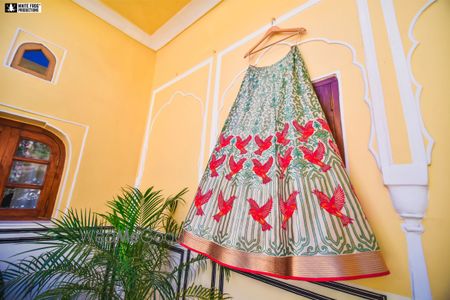 Photo of Bird motif unique bridal lehenga n hanger
