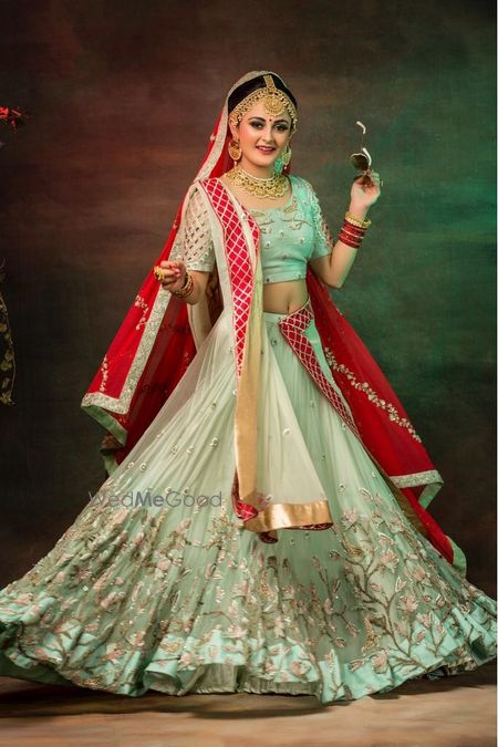 Pretty pastel lehenga with red dupatta 