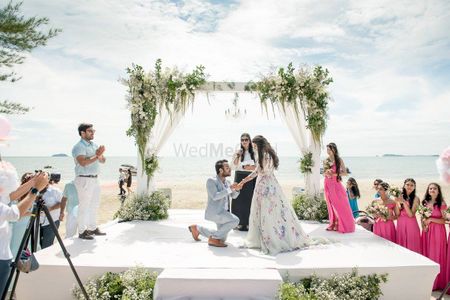 Photo of Cute proposal shot in beach wedding
