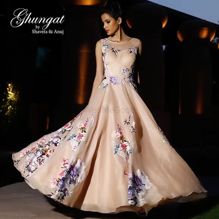 Photo of Light peach gown with floral prints