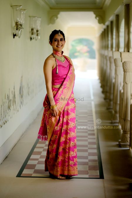 Bright pink unique saree drape with high neck blouse
