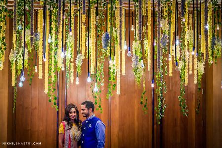 Lighting idea with floral strings hanging for engagement decor