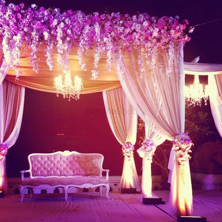 Light pink floral mandap woth curtains