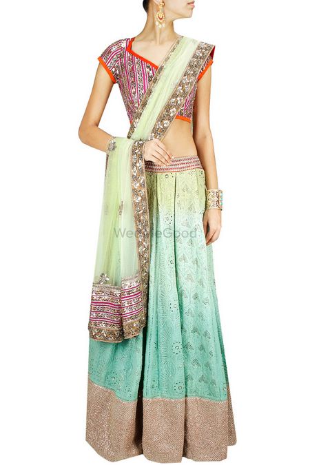 Photo of ombre lehenga in lime green and turquoise with gota work border and purple mirror work blouse and mint dupatta