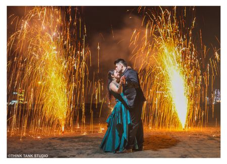 Couple shot with fire works background