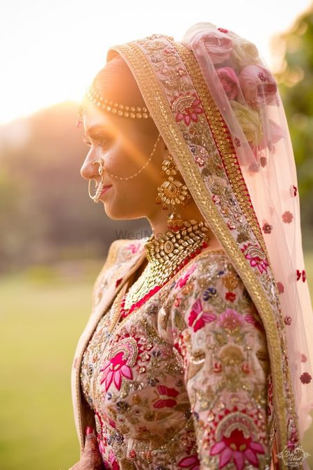 Photo of Matching bridal bun with floral embroidery lehega