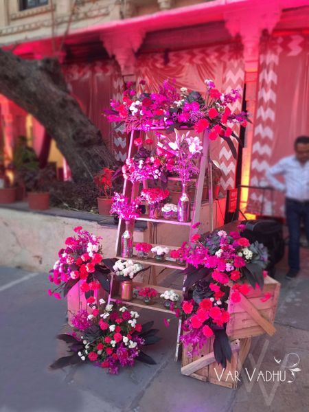 Photo of Pink Ladder with Floral Decor
