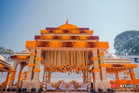 Photo of Pretty orange and red floral decor for mandap